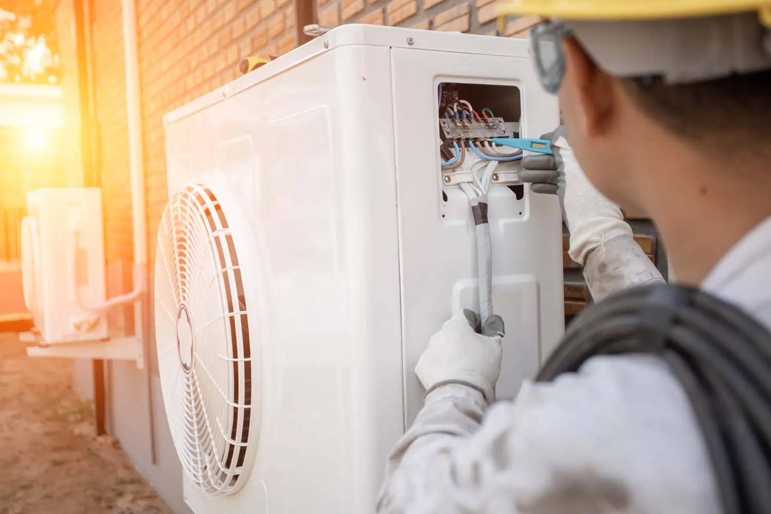 Technician performing exterior maintenance